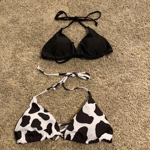 A black and a cow print bikini top